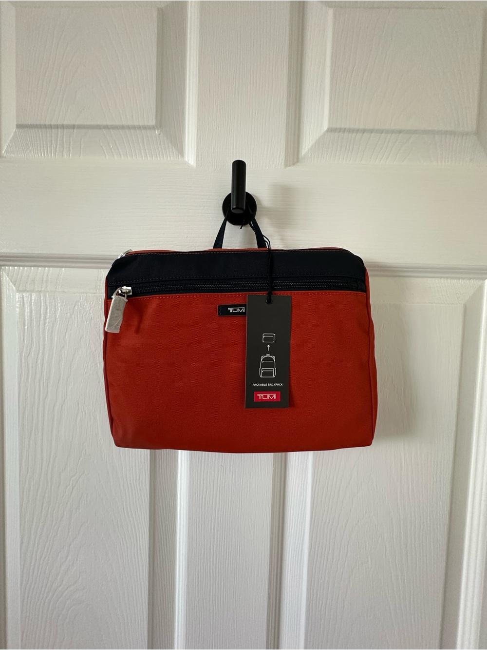 Tumi orange and Black Travel  bagpack